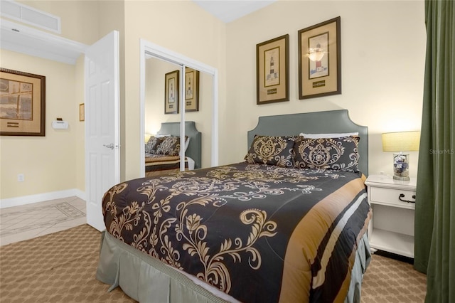 bedroom featuring carpet and a closet