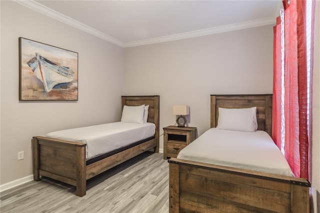 bedroom featuring wood-type flooring and crown molding