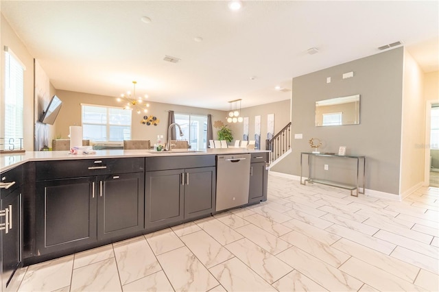 kitchen with stainless steel dishwasher, pendant lighting, an inviting chandelier, and sink