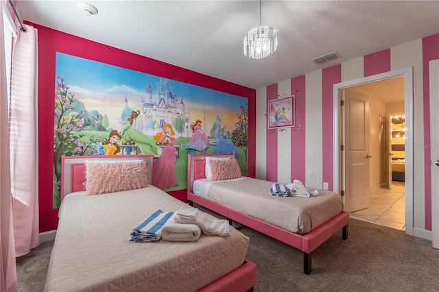 bedroom featuring carpet, a notable chandelier, and a textured ceiling