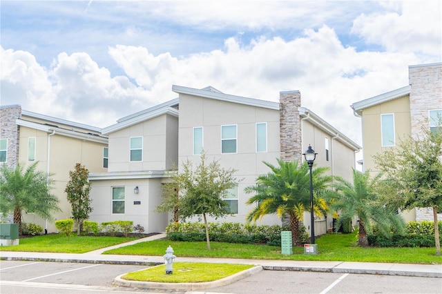 view of front facade with a front lawn