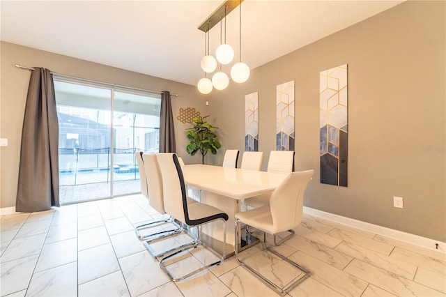 dining room with a notable chandelier