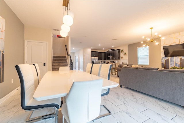 dining space featuring a chandelier