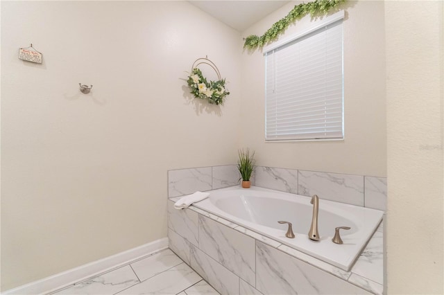 bathroom with a relaxing tiled tub