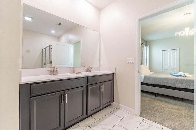 bathroom with an enclosed shower and vanity