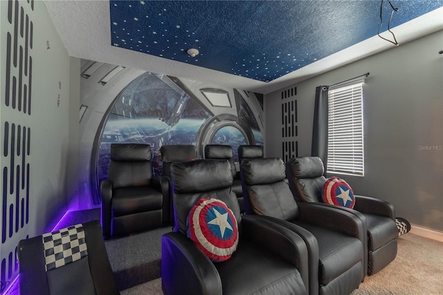 carpeted cinema room with a textured ceiling