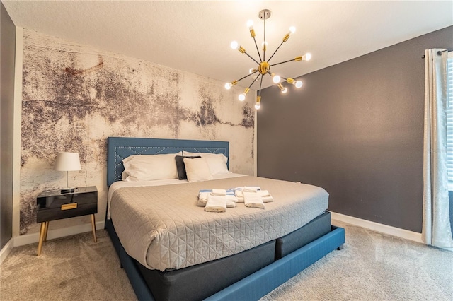 bedroom featuring carpet floors and a notable chandelier