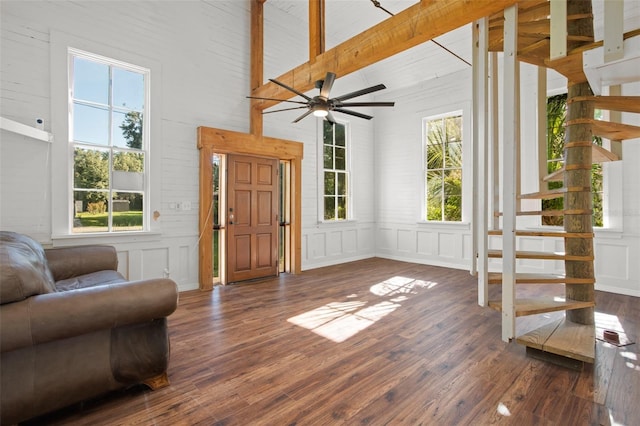 sitting room featuring vaulted ceiling with beams, dark hardwood / wood-style flooring, and plenty of natural light