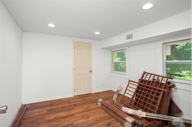 sitting room featuring dark wood-type flooring