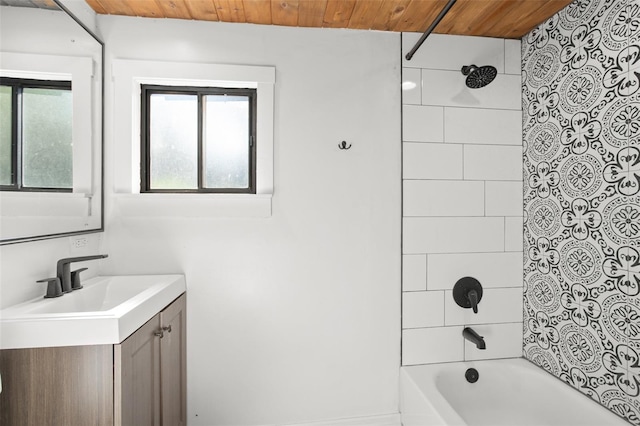 bathroom with vanity, wooden ceiling, and tiled shower / bath combo