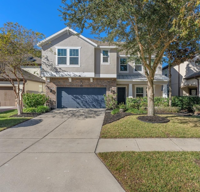 view of front of house with a front yard and a garage