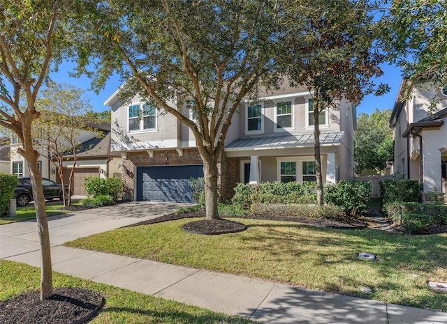 view of front of house with a front lawn and a garage