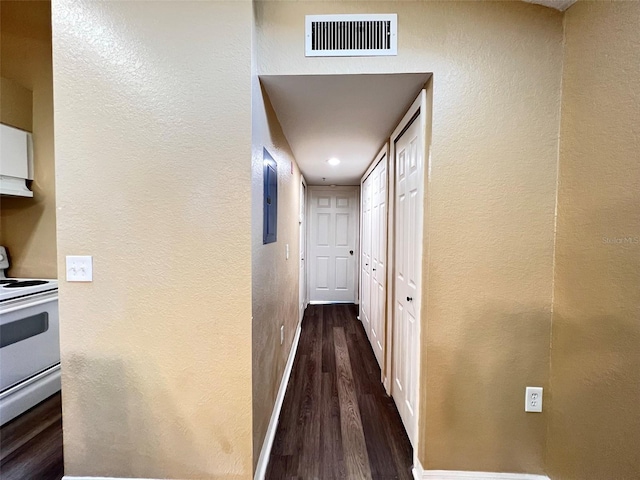 hallway with dark hardwood / wood-style flooring