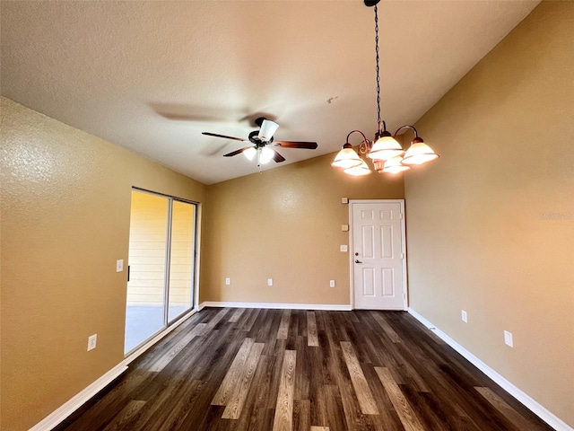 unfurnished room featuring ceiling fan with notable chandelier, hardwood / wood-style flooring, and lofted ceiling