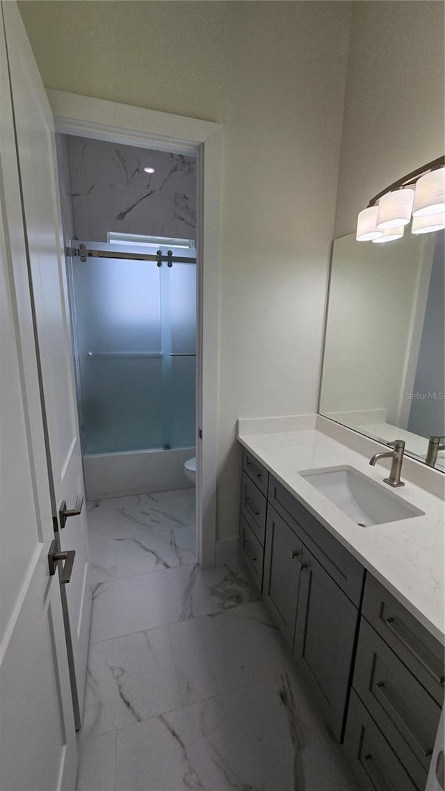 full bathroom with vanity, toilet, and enclosed tub / shower combo