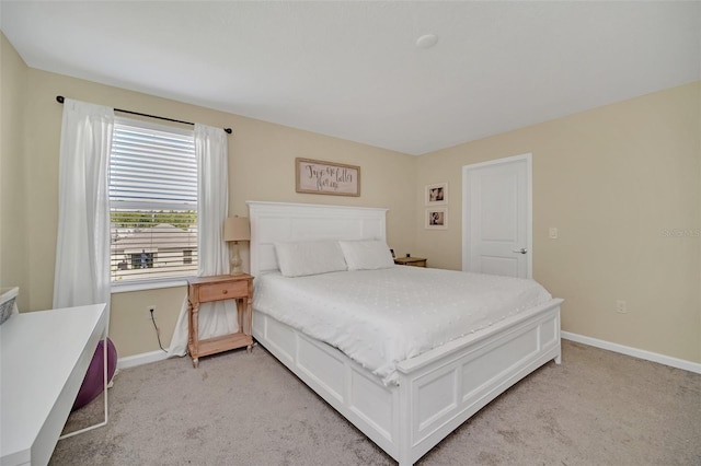 bedroom featuring light colored carpet