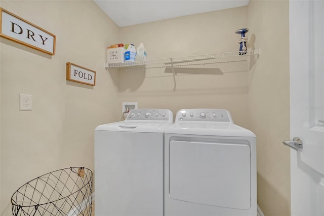 laundry area with washer and clothes dryer and washer hookup