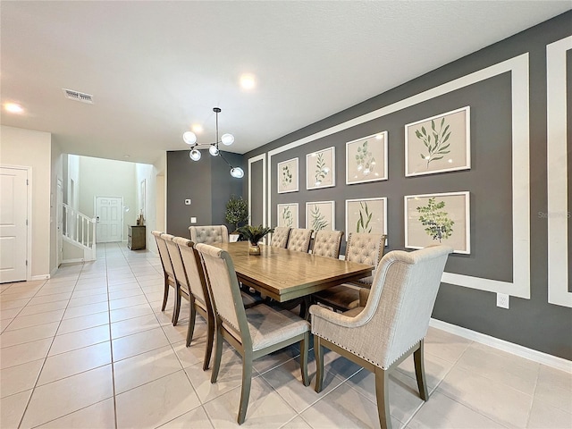 dining space with light tile patterned floors