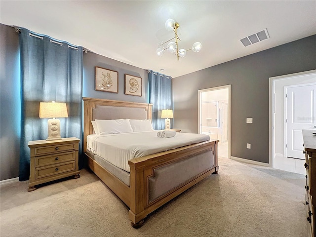 bedroom featuring connected bathroom, light colored carpet, and a notable chandelier