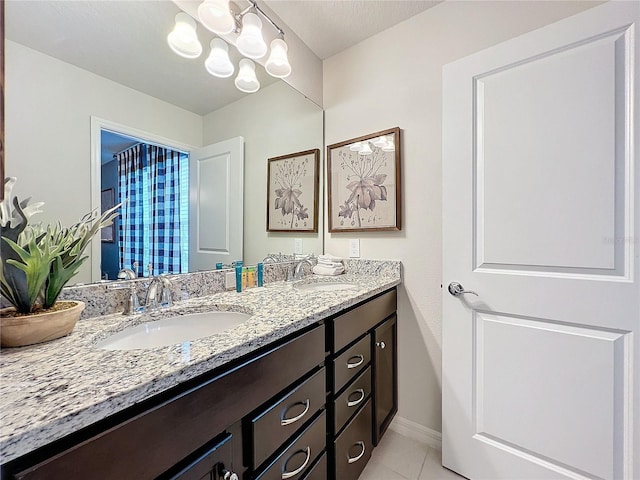 bathroom featuring tile patterned flooring and vanity