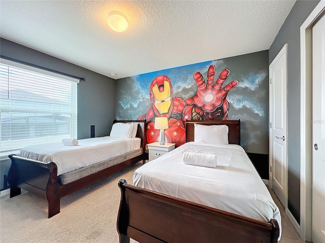 bedroom featuring carpet floors and a textured ceiling