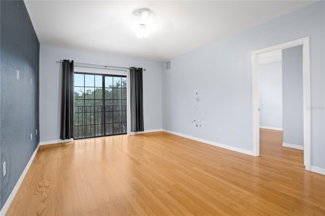 spare room featuring light hardwood / wood-style flooring