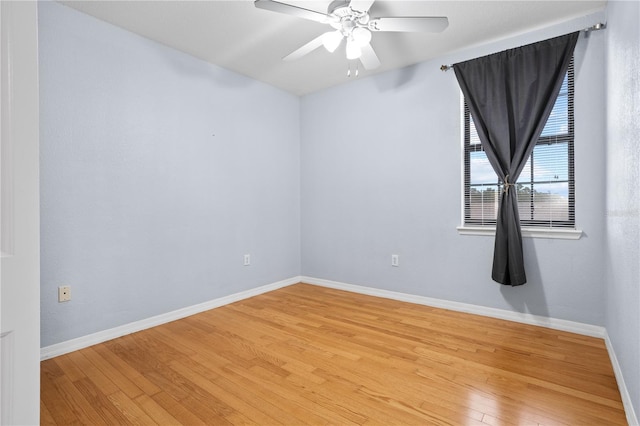 empty room with light wood-type flooring and ceiling fan