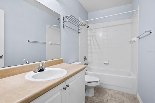 full bathroom with washtub / shower combination, tile patterned floors, vanity, and toilet