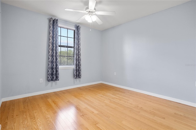 spare room featuring light hardwood / wood-style flooring and ceiling fan