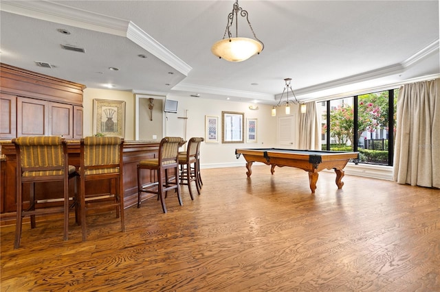 recreation room featuring hardwood / wood-style floors, crown molding, and billiards