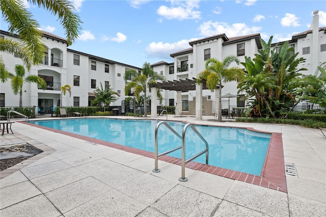 view of pool featuring a patio area and a pergola