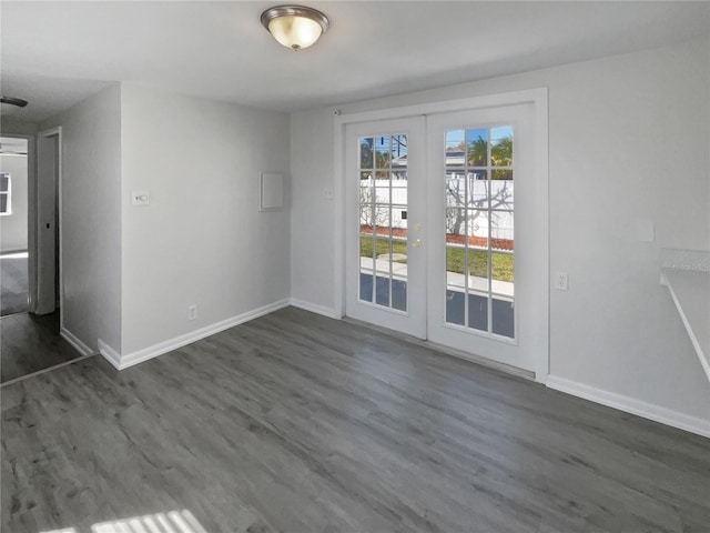 interior space with baseboards, dark wood-style flooring, and french doors