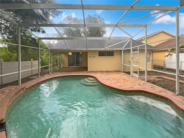 view of pool featuring a lanai