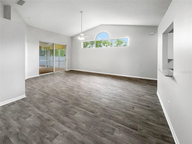 interior space featuring ceiling fan, dark hardwood / wood-style flooring, lofted ceiling, and plenty of natural light