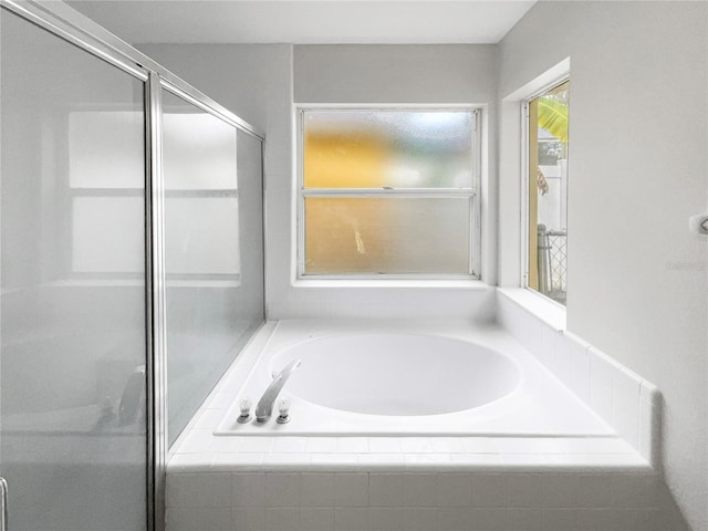 bathroom with separate shower and tub