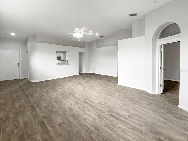 unfurnished living room with hardwood / wood-style floors, ceiling fan, and lofted ceiling