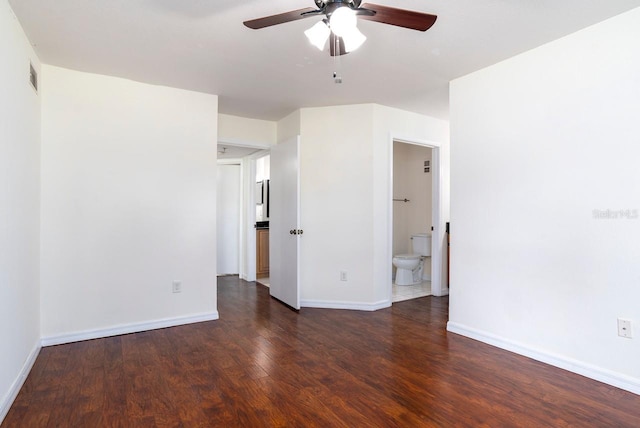 unfurnished room featuring ceiling fan and dark hardwood / wood-style flooring