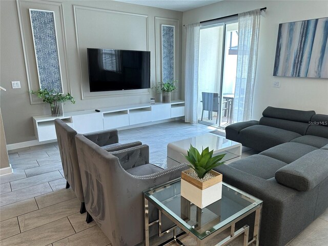 living room with wood tiled floor and baseboards