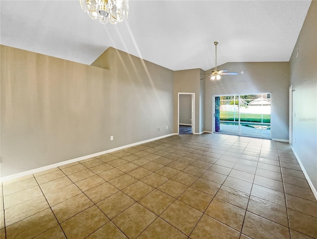 interior space with tile patterned flooring, high vaulted ceiling, and ceiling fan with notable chandelier