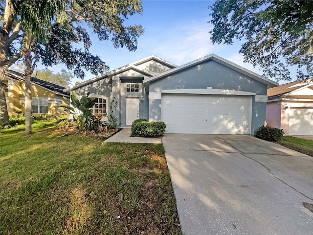 view of front facade featuring a garage and a front yard