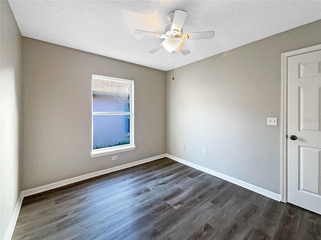 unfurnished room featuring ceiling fan, dark wood-type flooring, and a textured ceiling