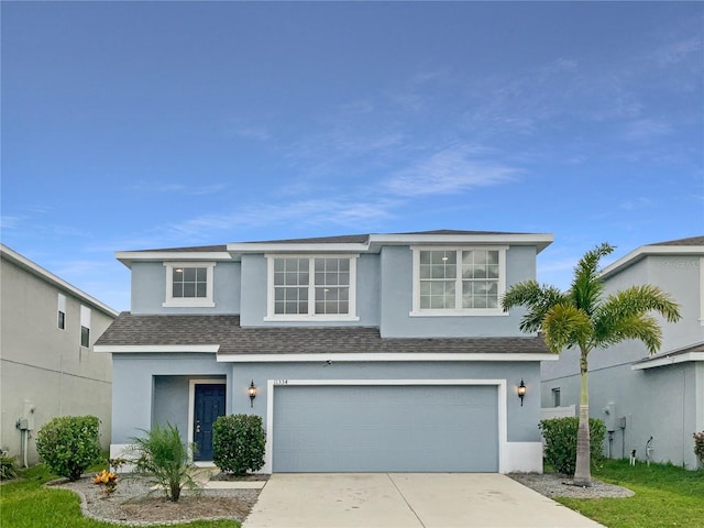 view of front of property with a garage