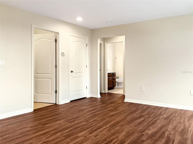 spare room with dark hardwood / wood-style flooring