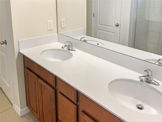 bathroom with tile patterned floors and vanity