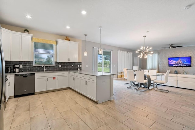 kitchen featuring white cabinetry, dishwasher, kitchen peninsula, and pendant lighting