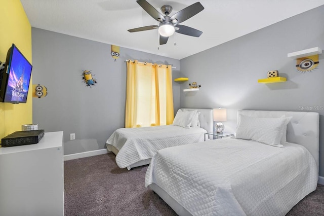 bedroom featuring ceiling fan and dark carpet