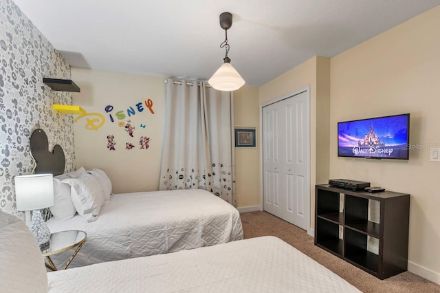 carpeted bedroom featuring a closet