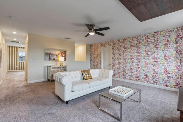 living room with carpet flooring and ceiling fan