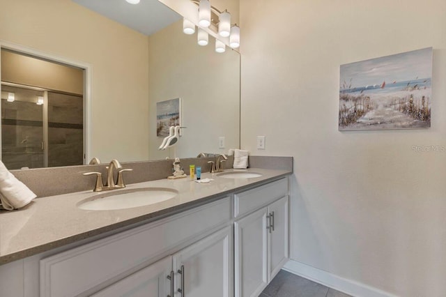 bathroom with vanity, tile patterned floors, and walk in shower