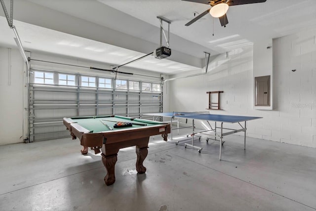 game room with concrete flooring and electric panel